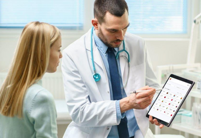 Walsall NHS doctor using Wordskii on a tablet to communicate with a patient