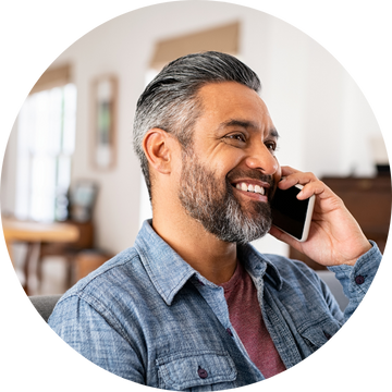 Walsall healthcare professional, smiles as he uses Wordskii to book an interpreter