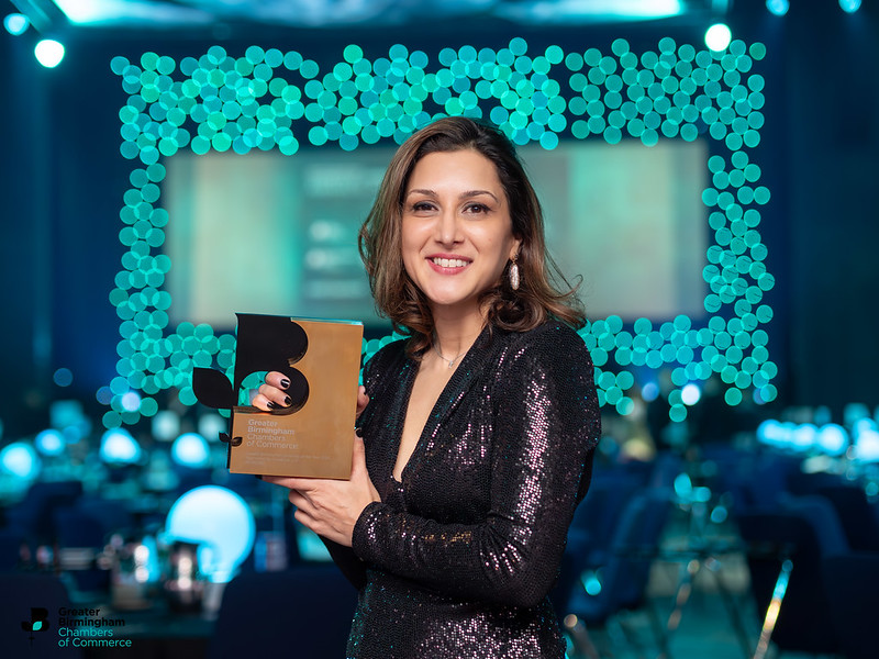 Kavita Parmar holding Word360's new awards