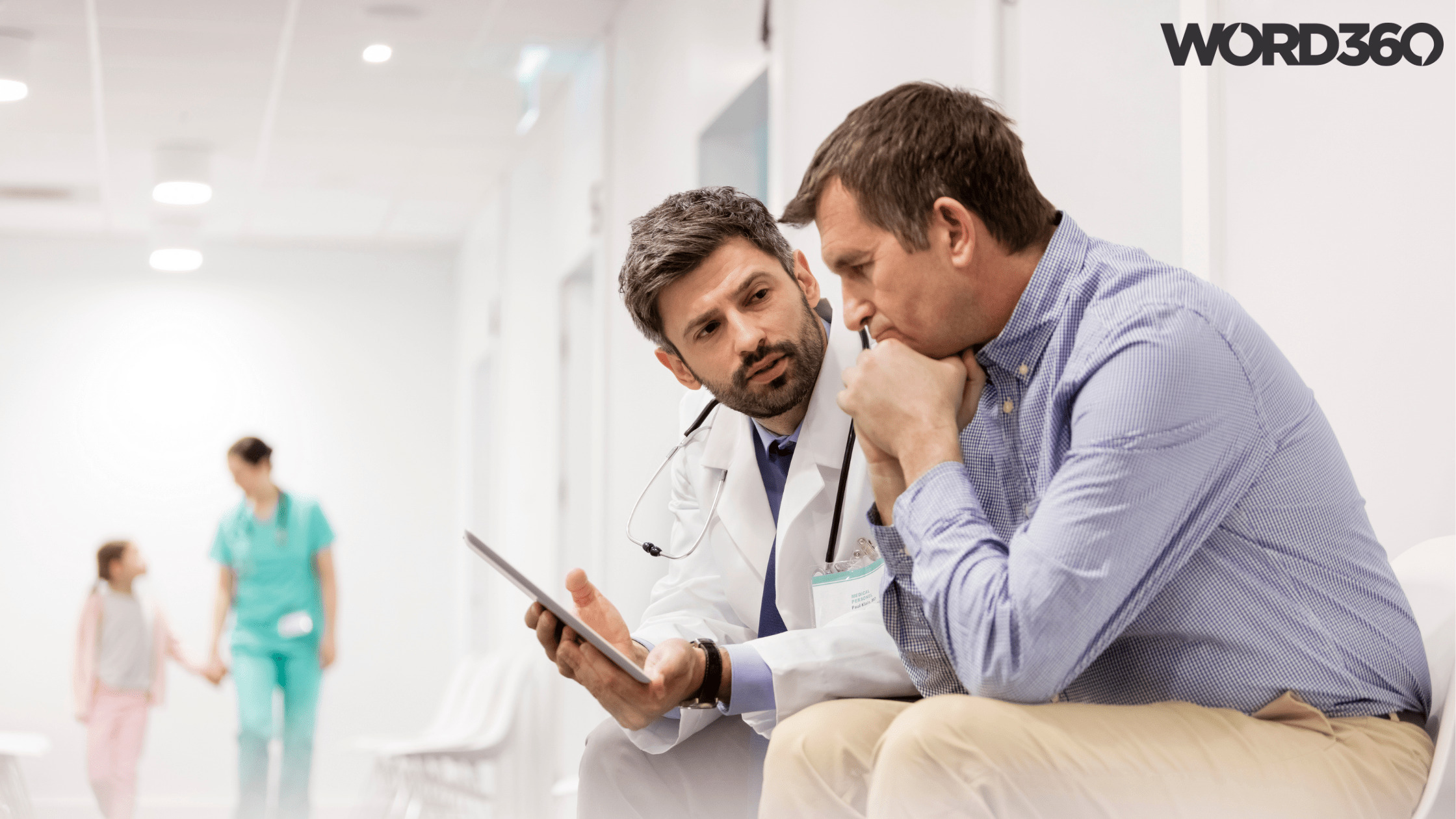 Doctor holding tablet for patient